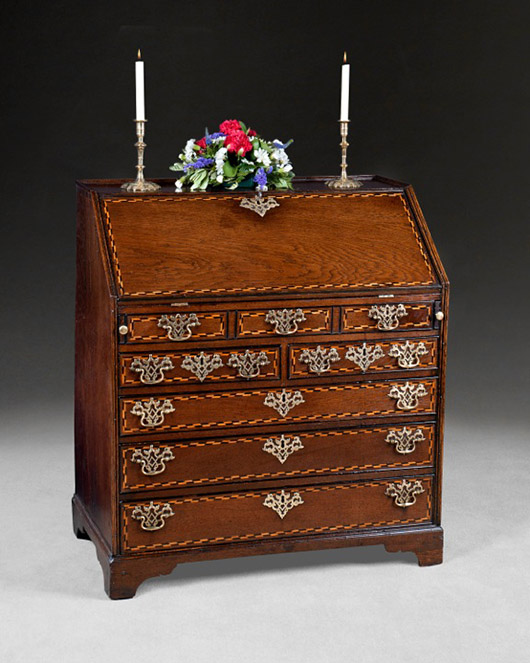 This rare 18th-century oak and holly-inlaid bureau with its original fixtures and fittings is for sale on the newly revamped website of W.R. Harvey (Antiques) Ltd. of Witney, Oxfordshire where it is priced £4,250 ($7,025). Image courtesy of W.R.Harvey (Antiques) Ltd.
